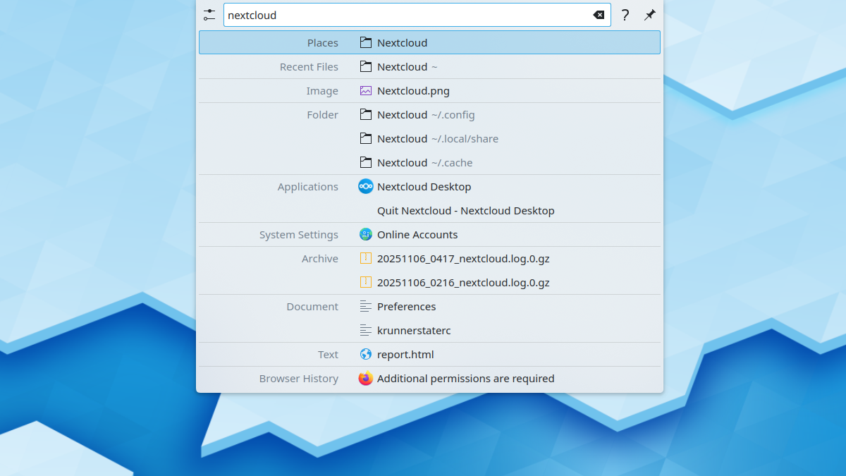 The KRunner app open at the top of a Plasma desktop, with several commands and search results available for a "nextcloud" search term.